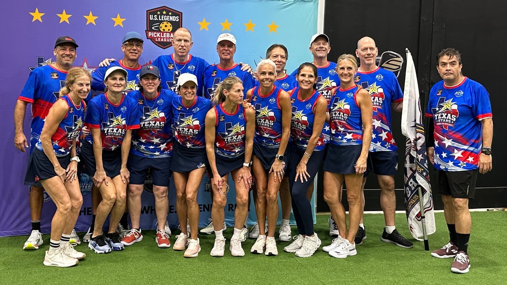 The Texas Stars 50+ senior pro pickleball team posing together in front of the U.S. Legends Pickleball League backdrop